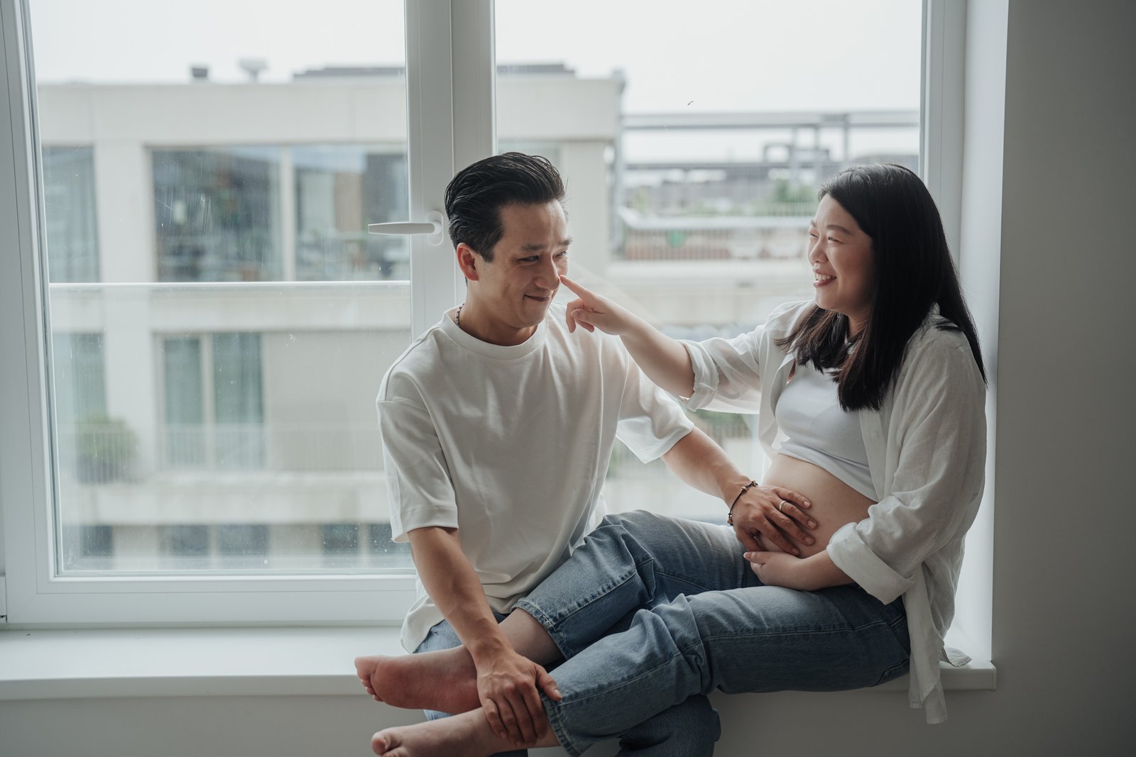 Amsterdam maternity portrait with a warm candid interaction