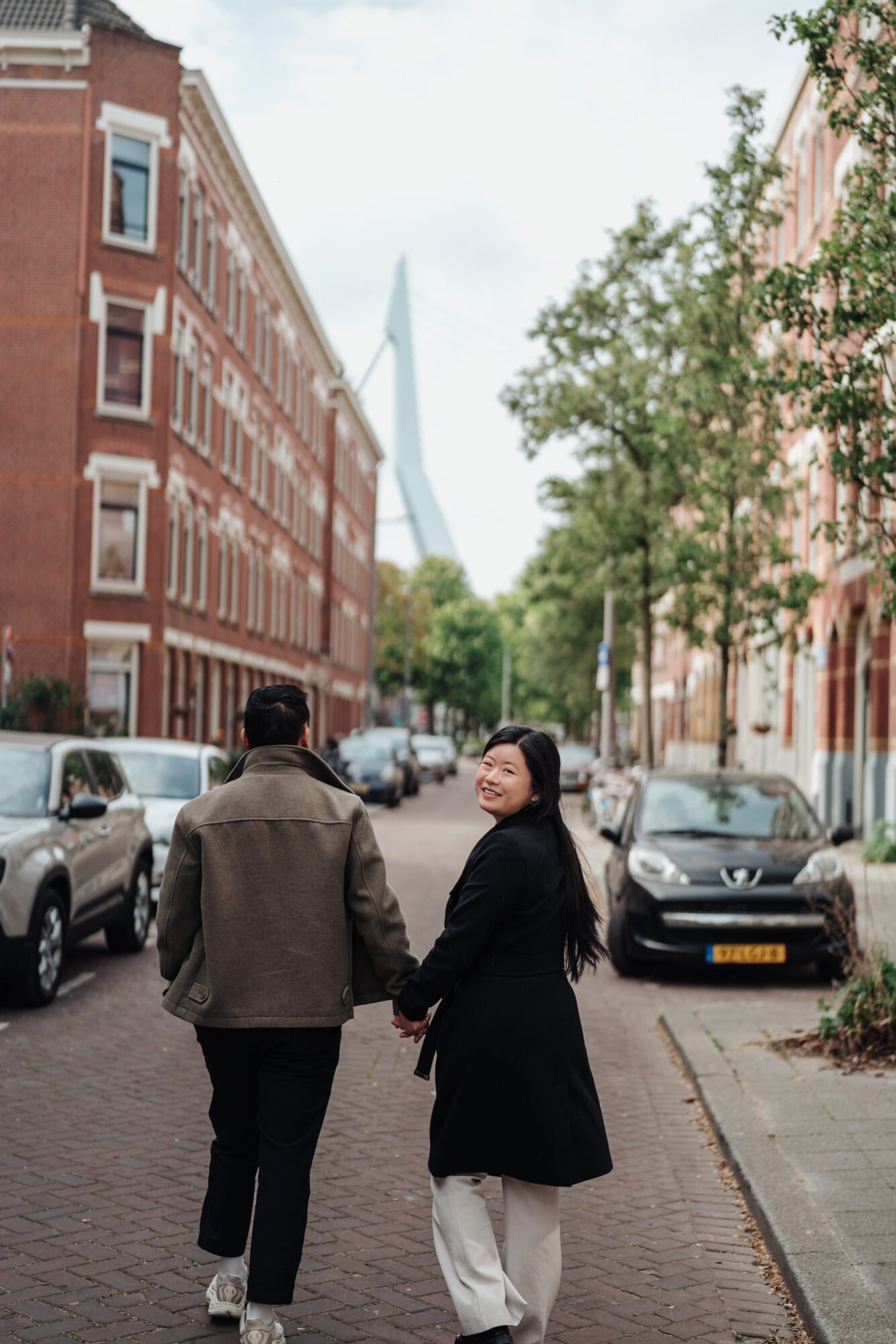 Urban city couple portrait session at Erasmus Bridge in Rotterdam