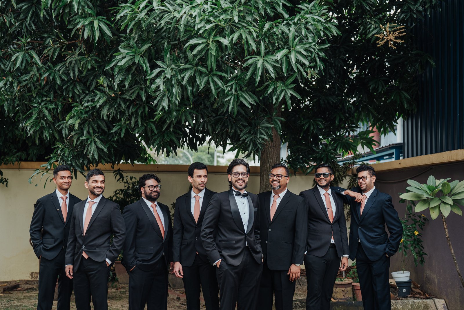 Groom and groomsmen together before a St. Thomas More Church wedding