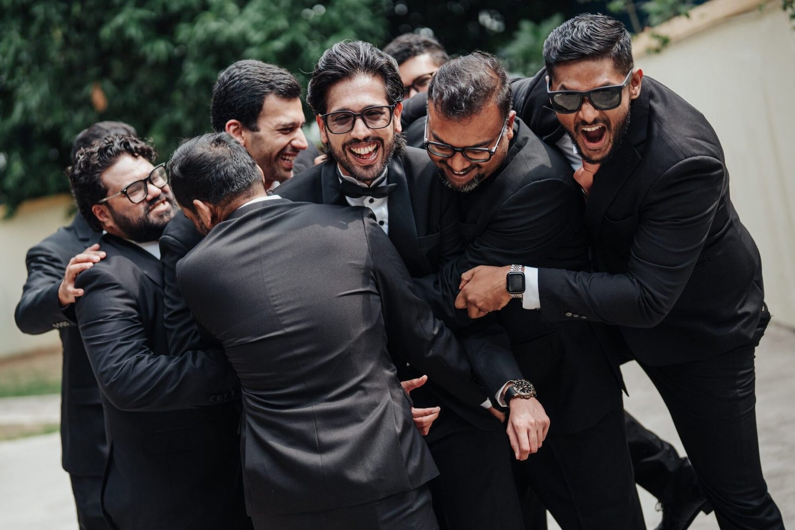 Shashi laughing with his brother and groomsmen before the wedding ceremony