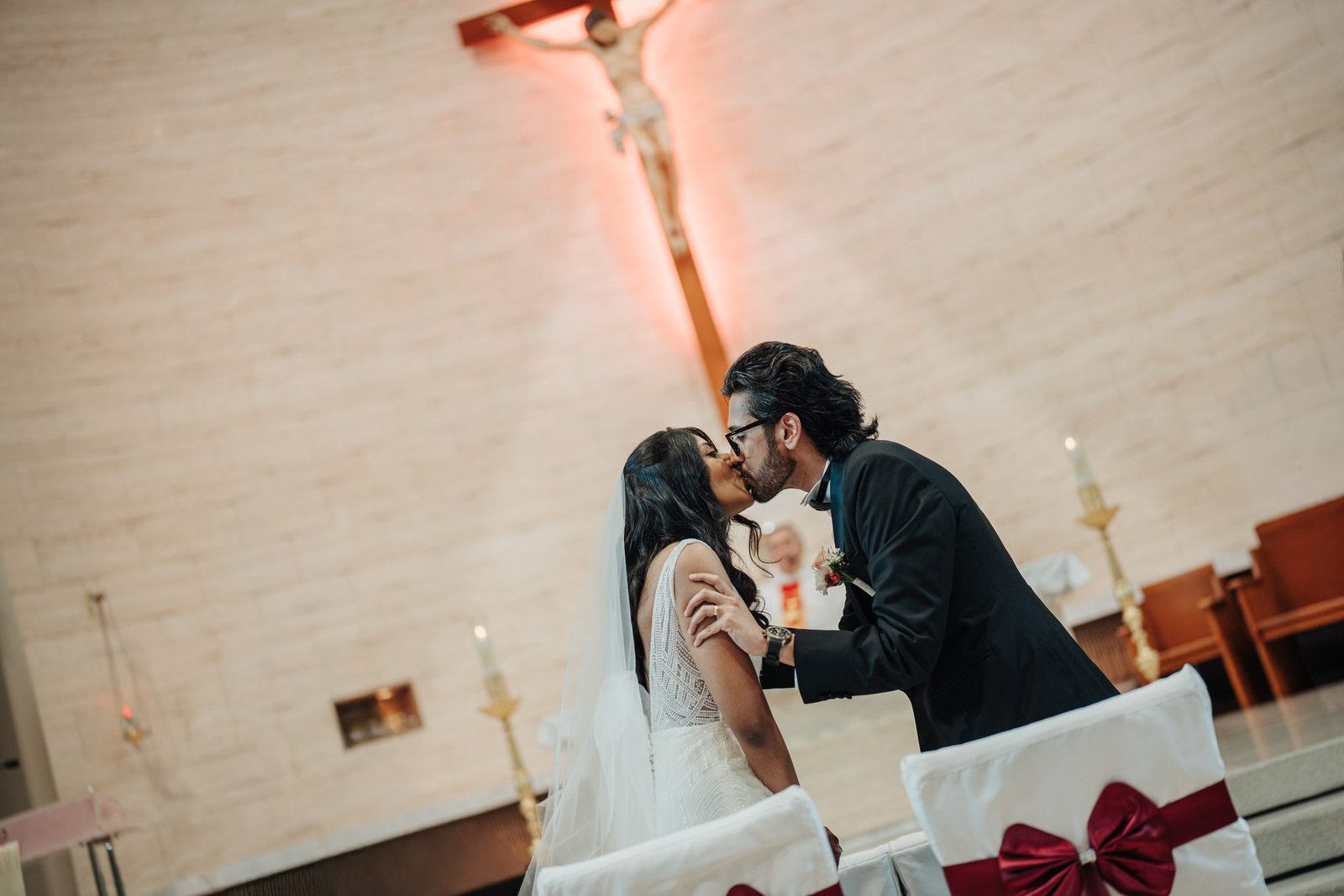 Asheelaa and Shashi sharing their first kiss after exchanging vows at St. Thomas More Church