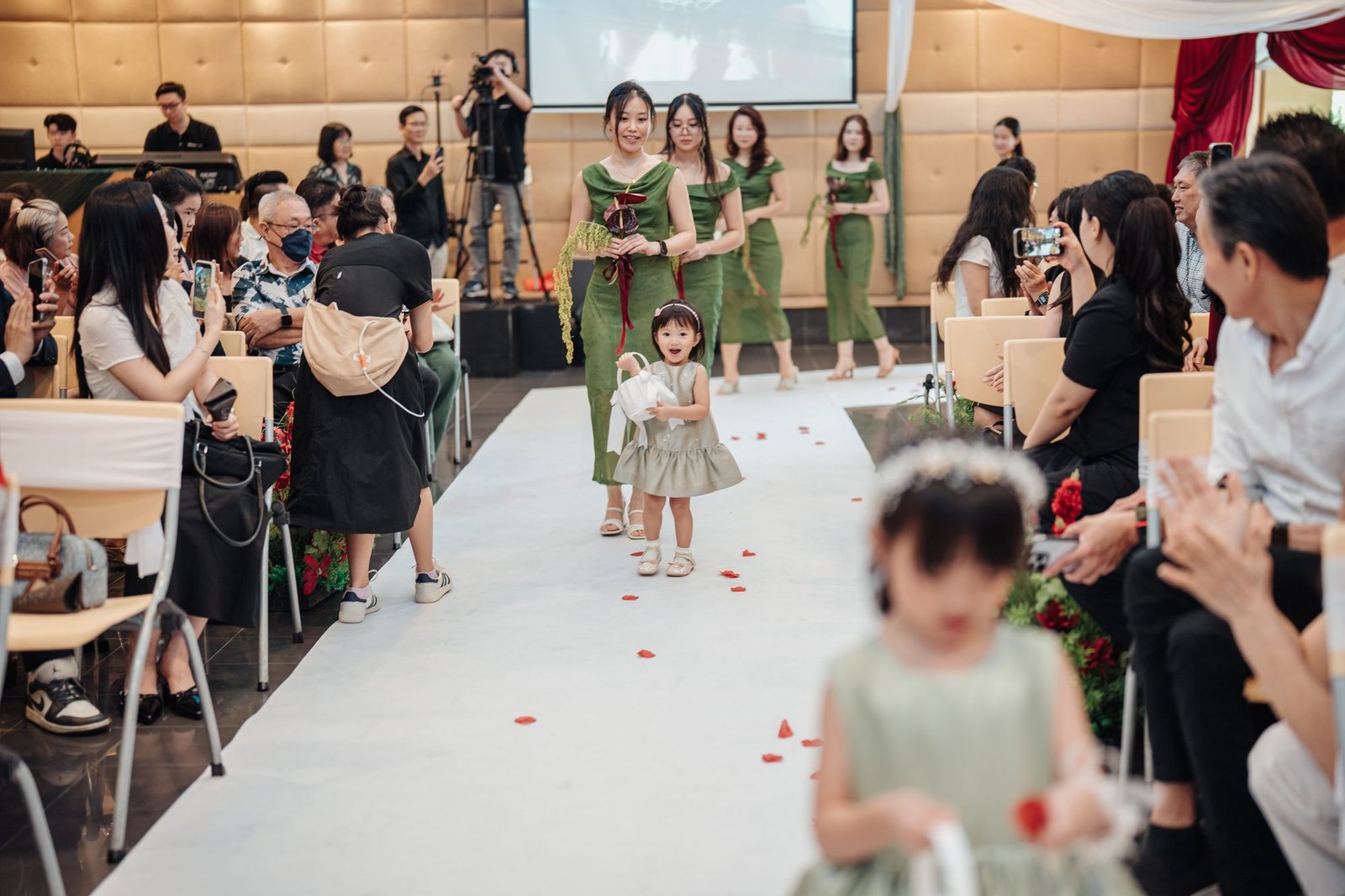 Flower girls walking down the aisle at Mega Chinese Methodist Church