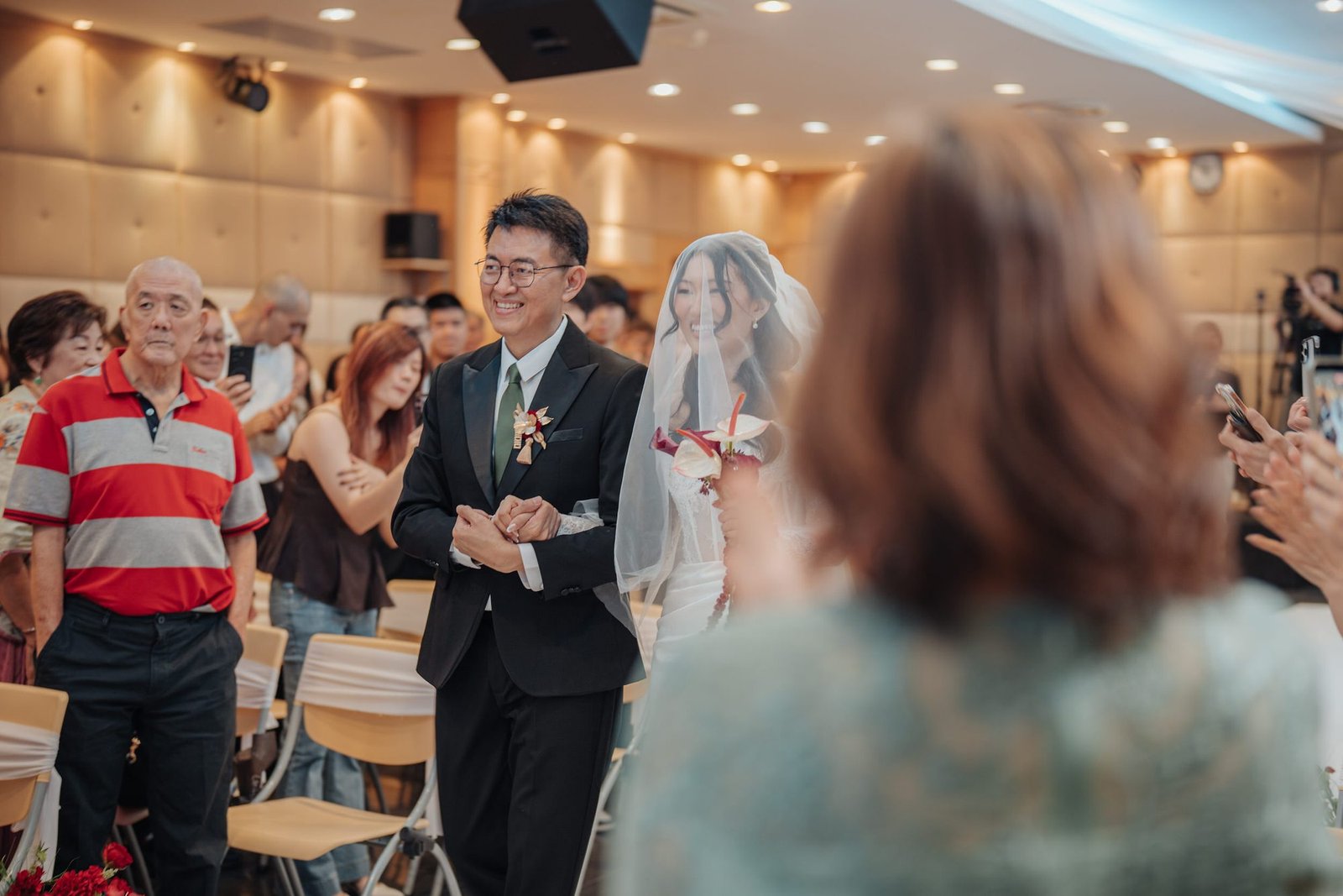 Silver walking into Mega Chinese Methodist Church with her father photographed by Cliff Choong Photography
