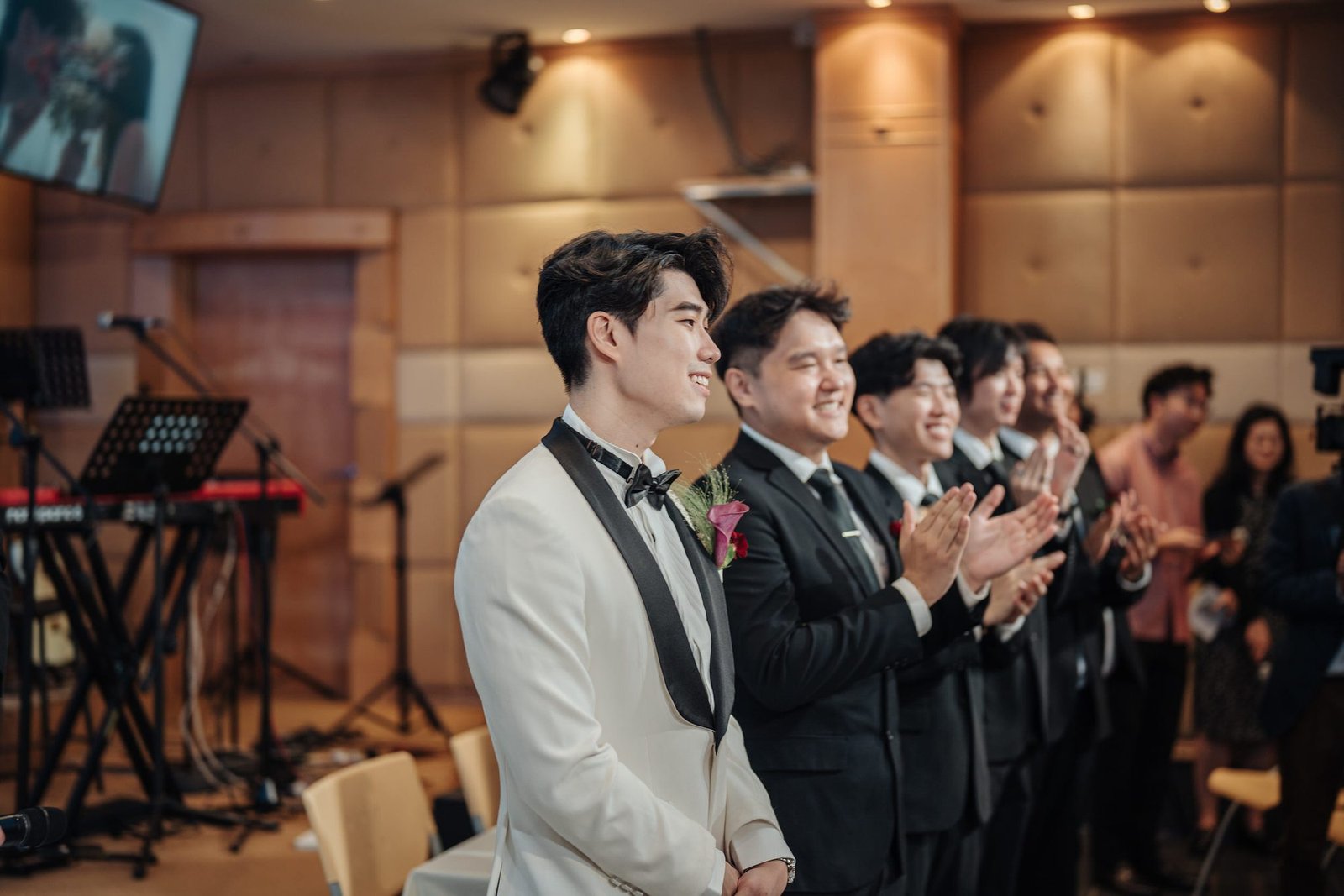 Yi Shien waiting with his groomsmen before the wedding ceremony photographed by Cliff Choong Photography